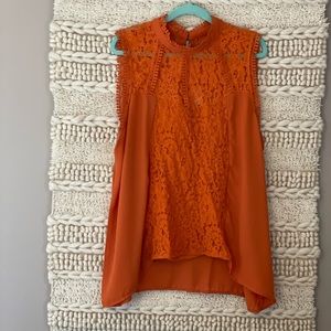 Size 2X burnt orange sleeveless blouse.